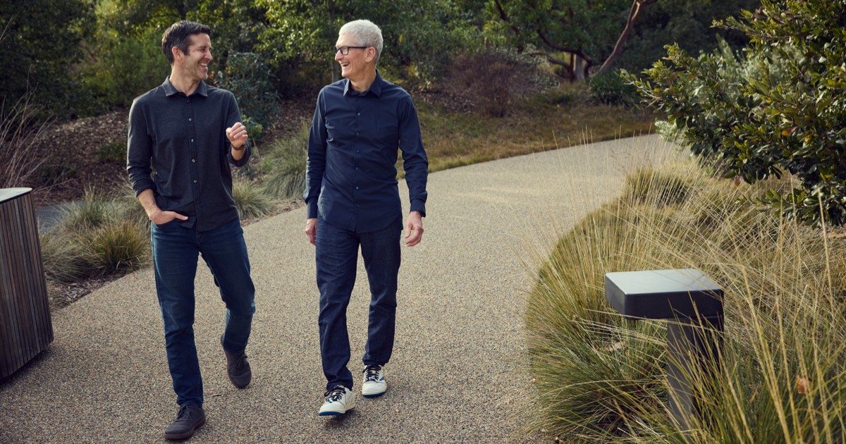 John Ternus and Tim Cook standing together at Apple Park, symbolizing the leadership transition.